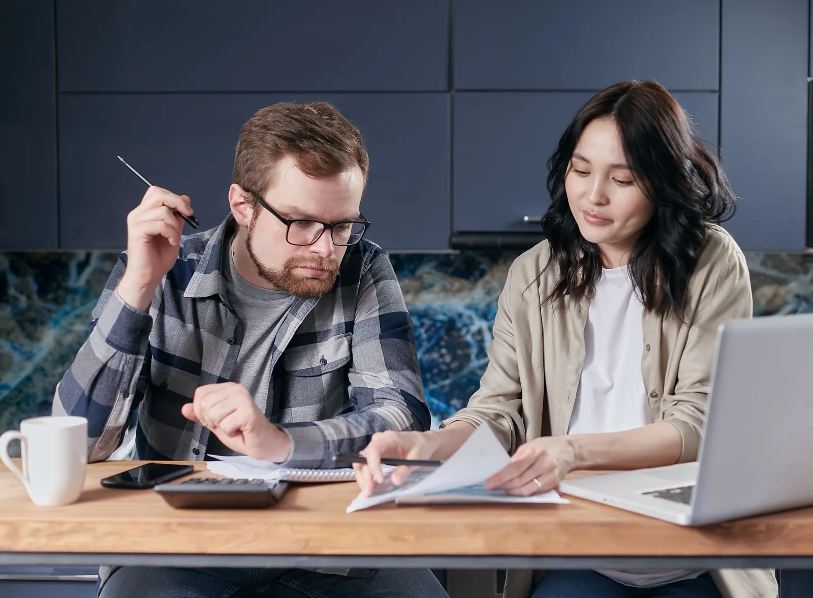 Homeowners comparing HVAC replacement and energy-saving options