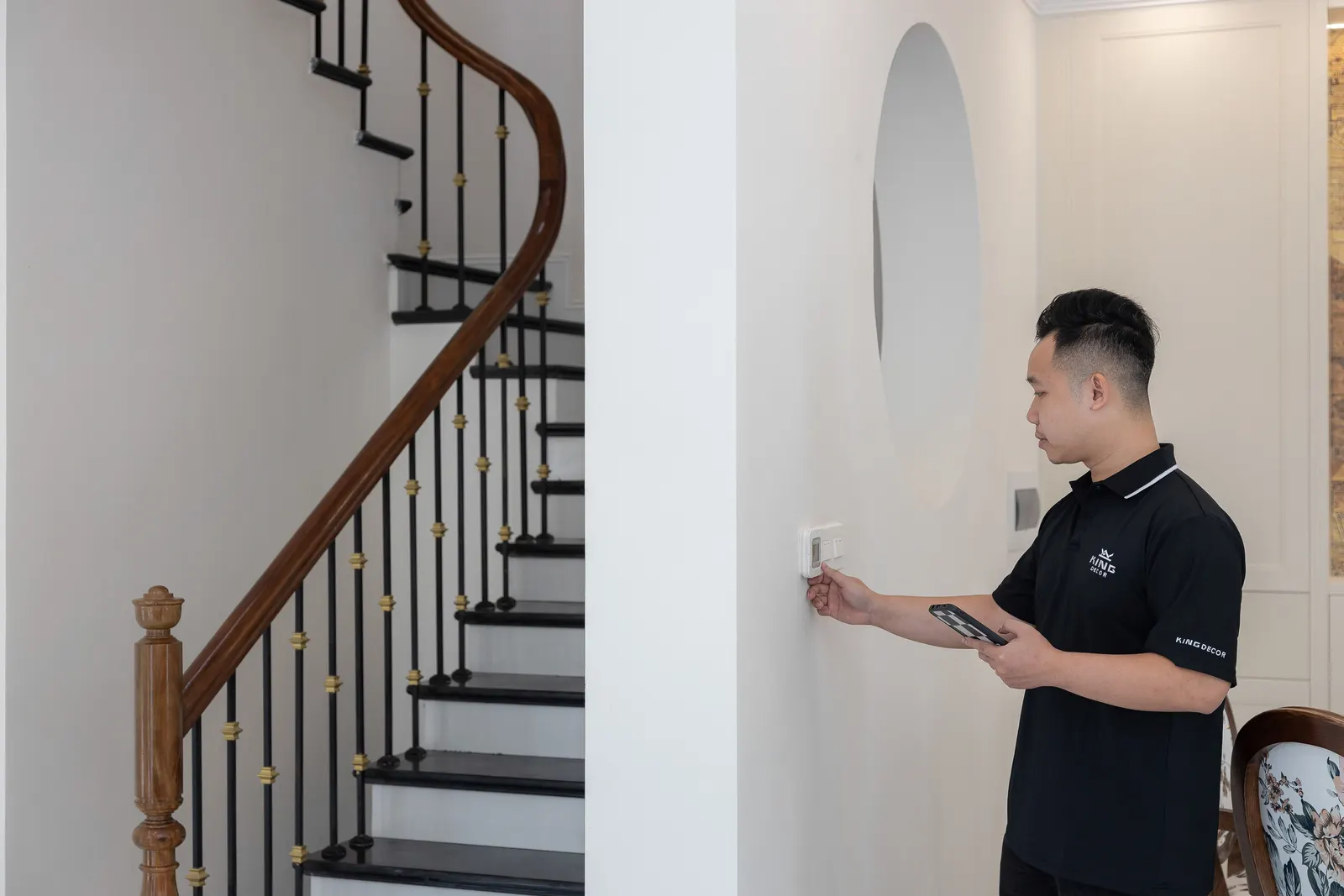 Home comfort advisor checking a residential thermostat